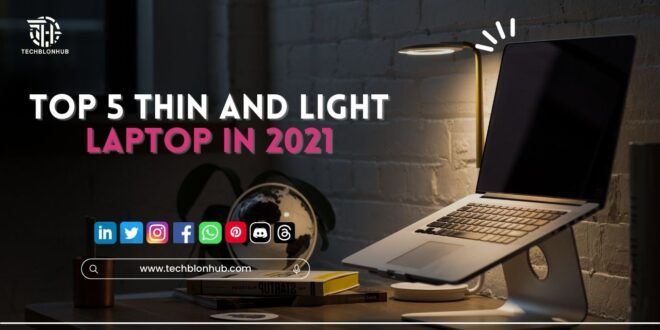 A lineup of sleek, thin, and lightweight laptops arranged on a modern desk.