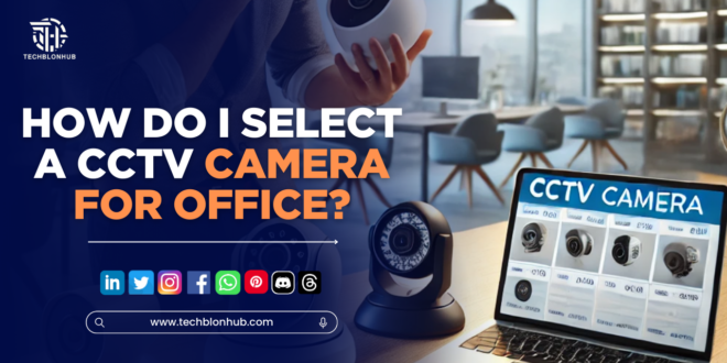 A modern office with a visible CCTV camera mounted on the ceiling, overlooking desks and workstations.